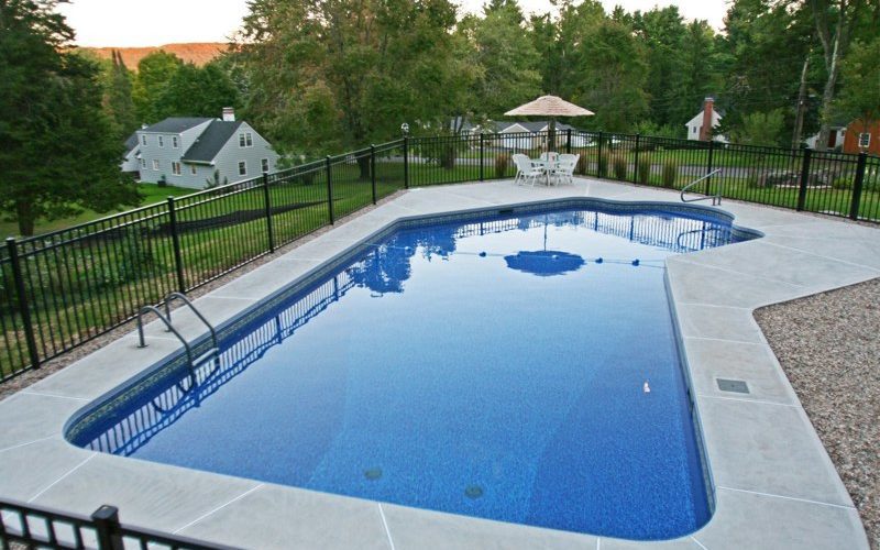This is a photo of a Lazy L style custom inground swimming pool.