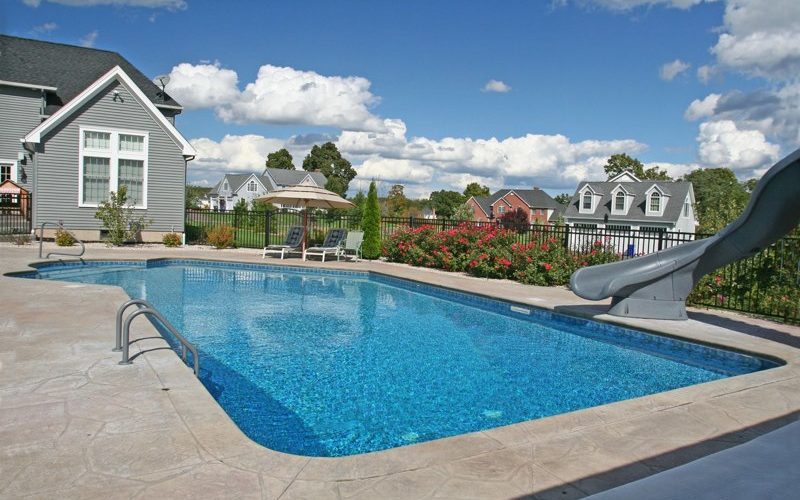 This is a photo of a Lazy L style custom inground swimming pool.